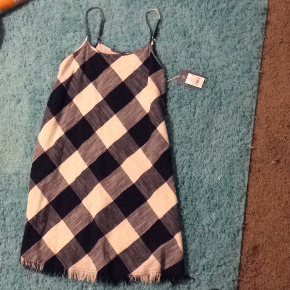 Woman’s black,white dress.